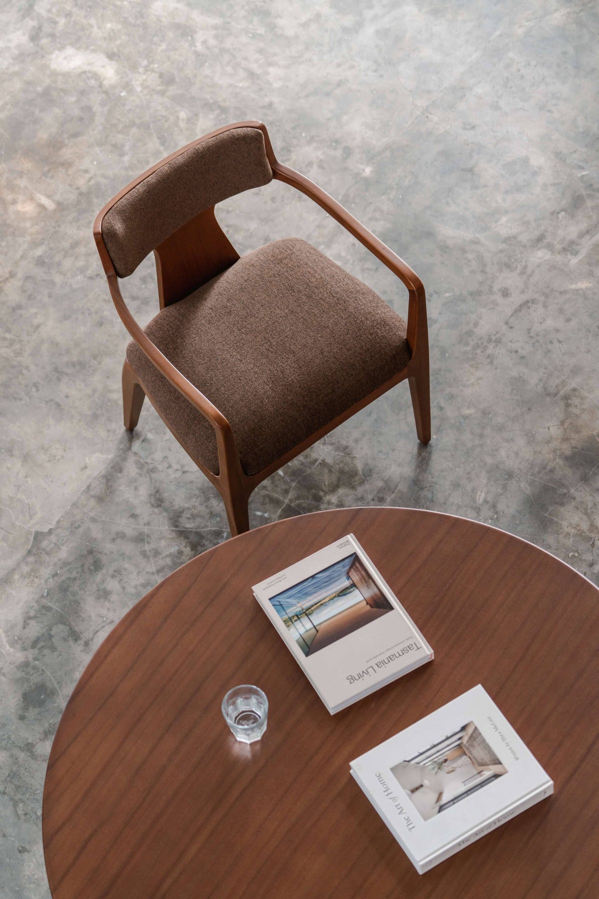 dark brown dining room chair with round dining table