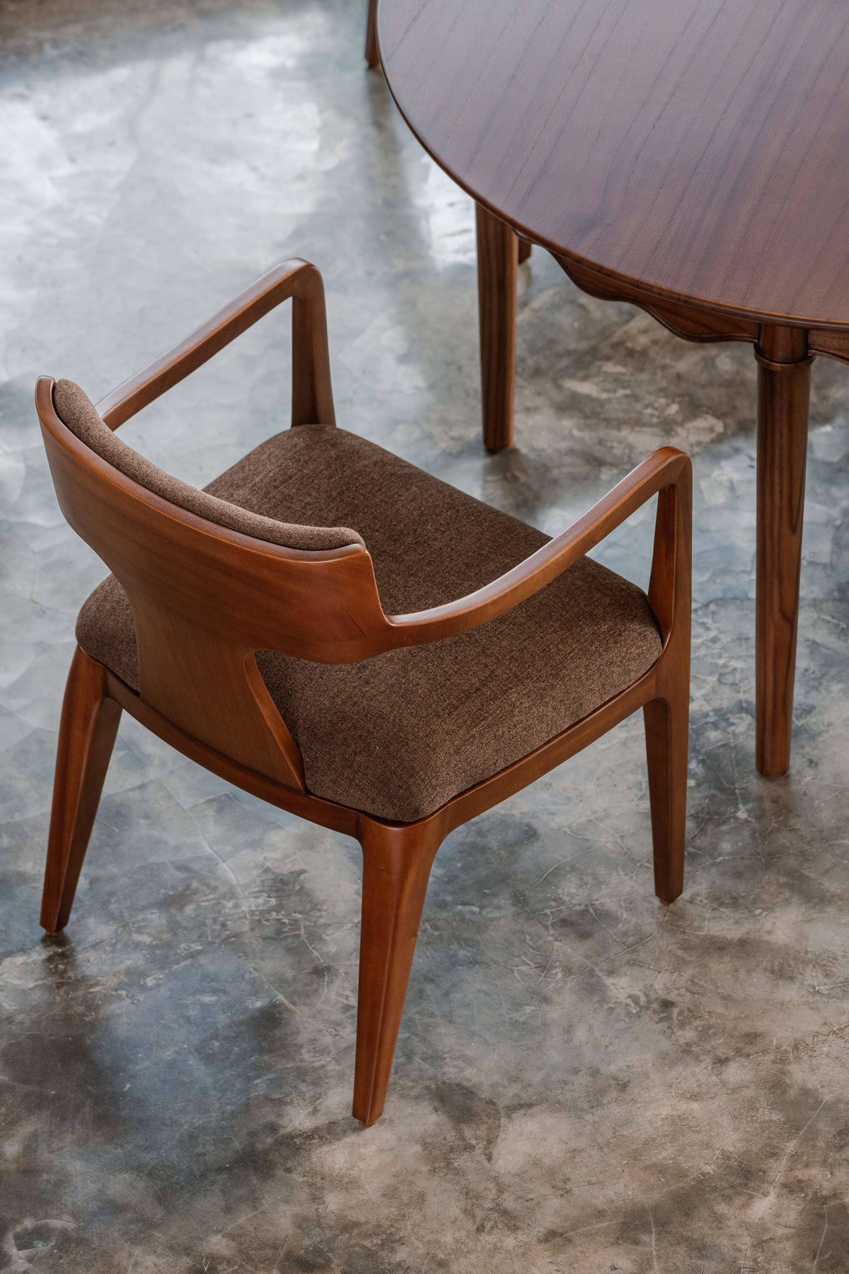 Wooden chair with brown cushion