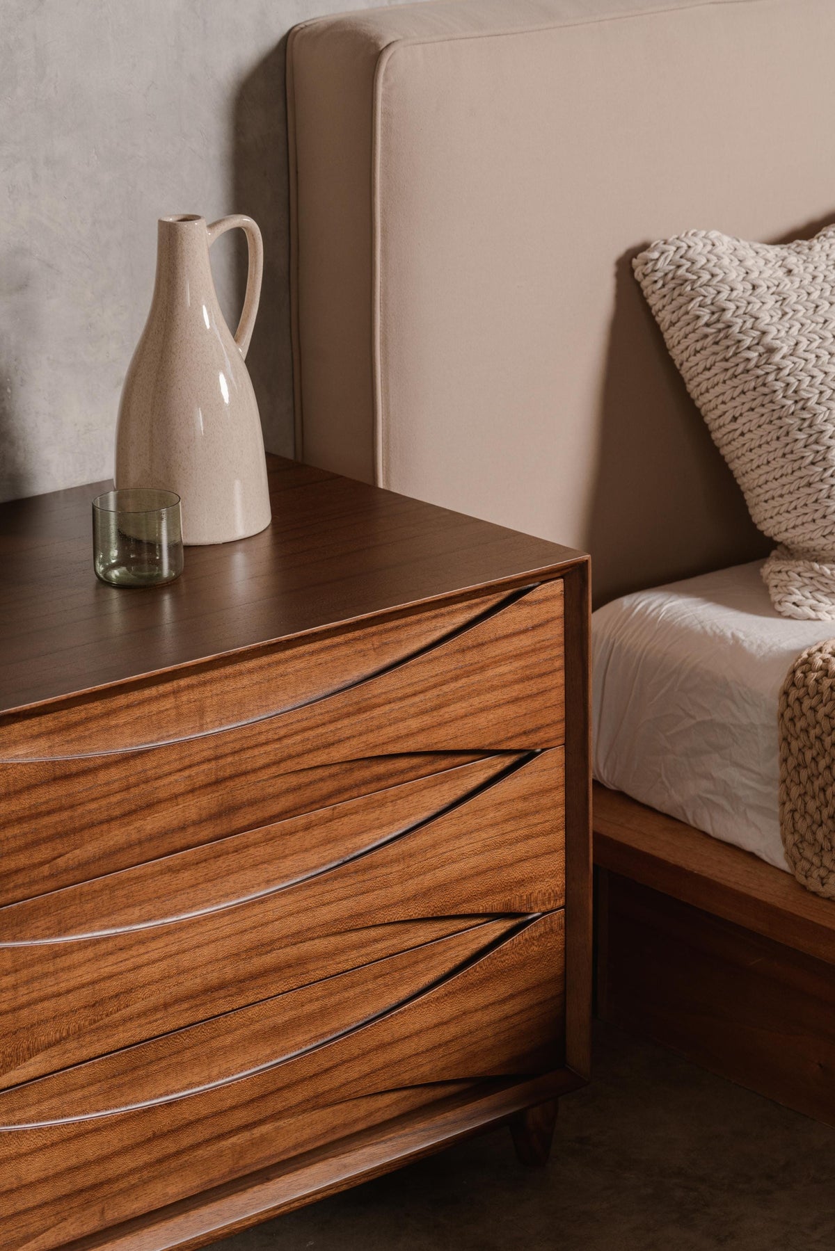 dark timber bedside table with drawers