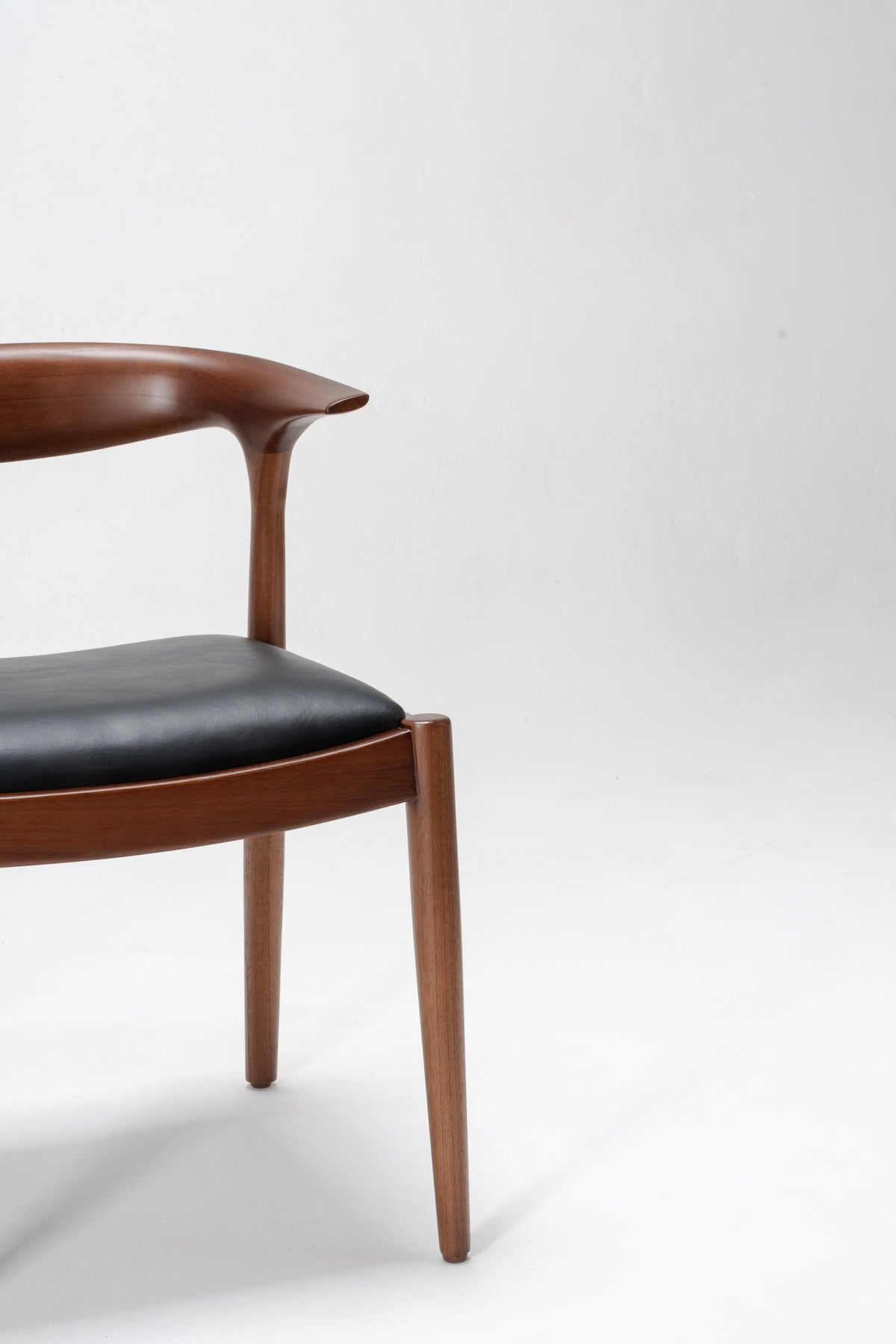 Wooden chair with black seat
