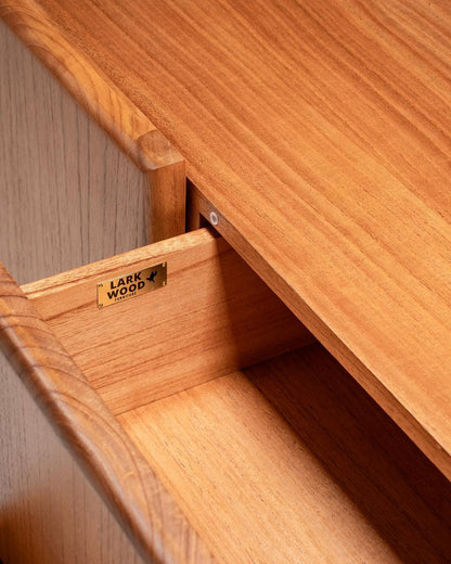 Wooden drawer with 'Larkwood' label on a tv console