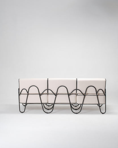 Modern outdoor couch with wavy metal legs