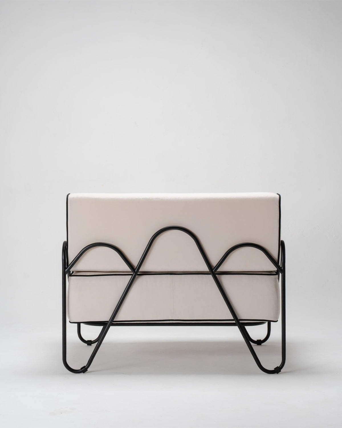modern outdoor armchair, black metal frame and white cuhsions