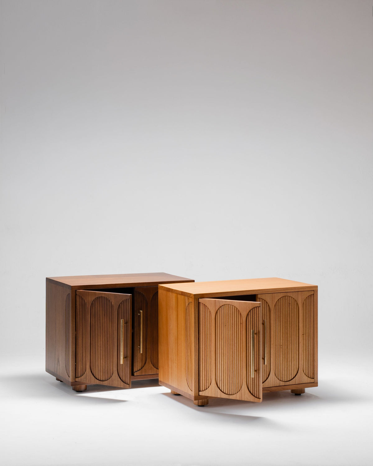 Two wooden bedside cabinets, in two colours