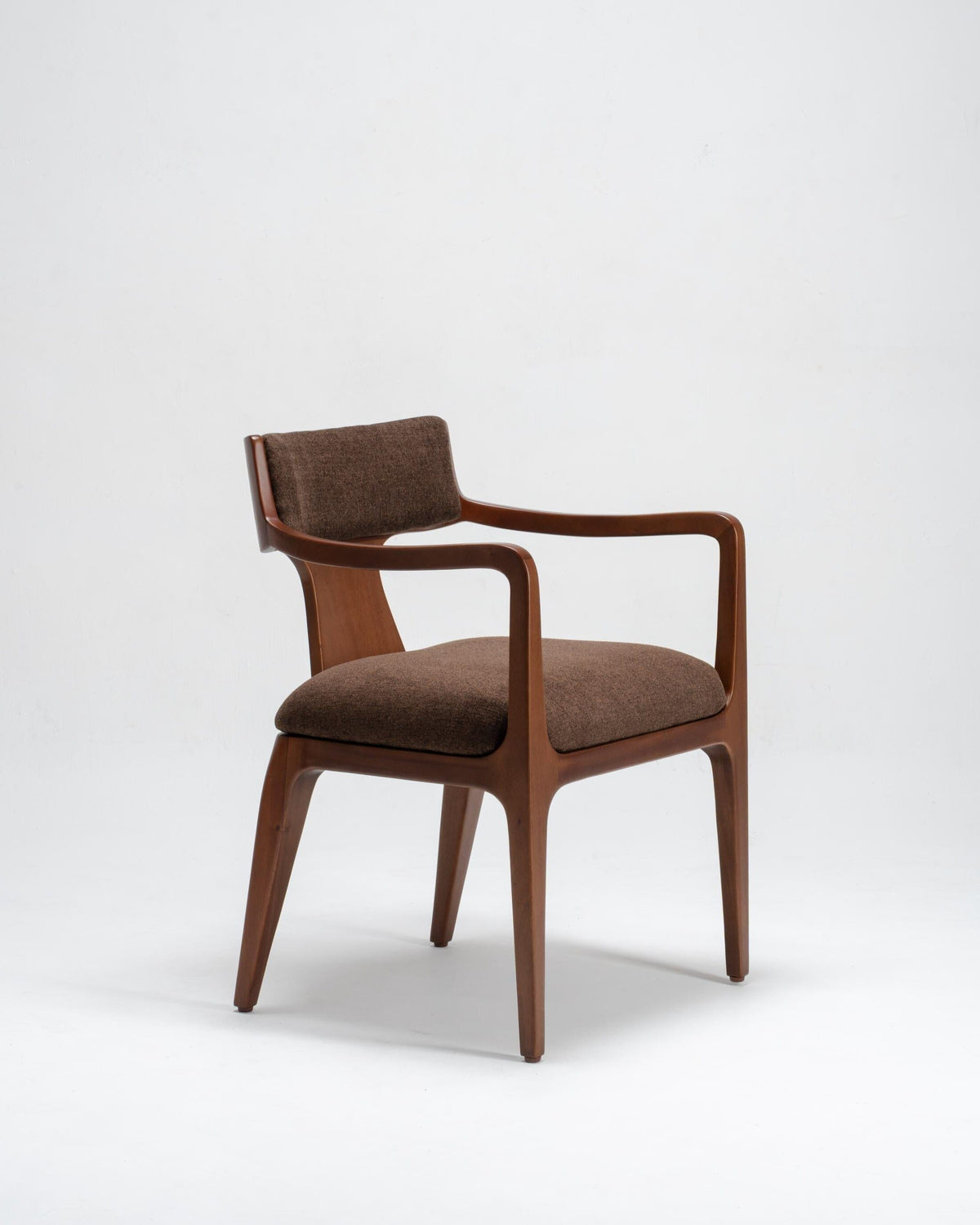 Brown dining chair with arms on a white background