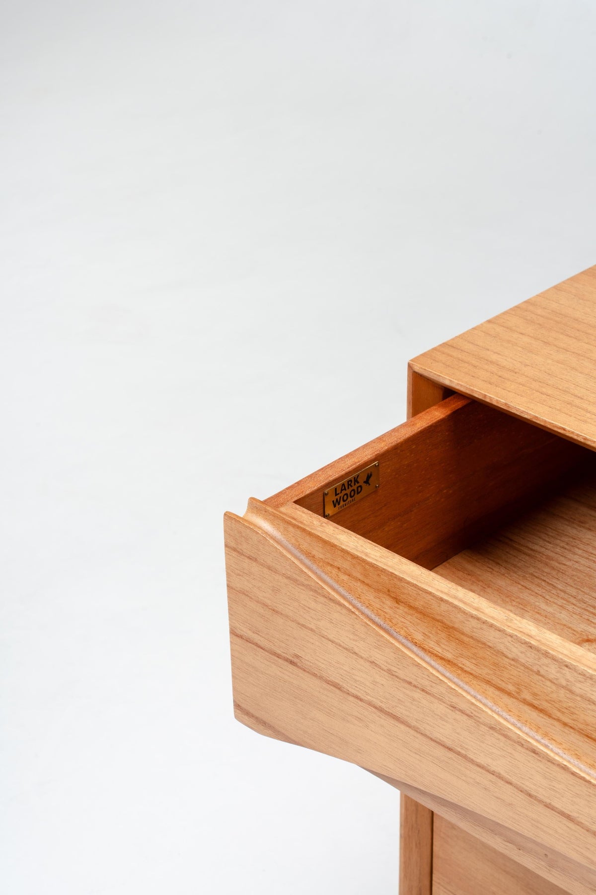 Wooden drawer open on a white background