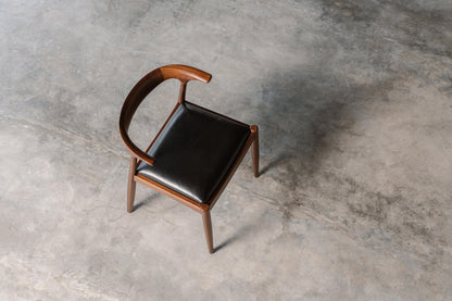 mahogany timber dining chair with black leather seat