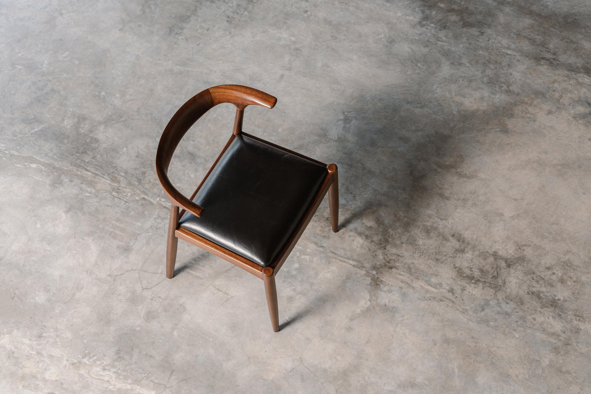 mahogany timber dining chair with black leather seat